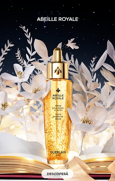 Ser Guerlain Abeille Royale pentru fermitate și strălucire, ambalaj auriu elegant, decor floral – descoperă online.